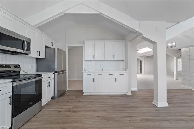 1320 Clay St, Franklin, VA 23851 - kitchen featuring stainless steel appliances, white cabinets, light countertops, backsplash, and light wood finished floors
