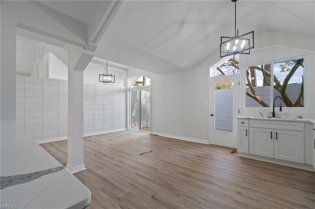 1320 Clay St, Franklin, VA 23851 - unfurnished dining area featuring a chandelier, light wood-style floors, and lofted ceiling