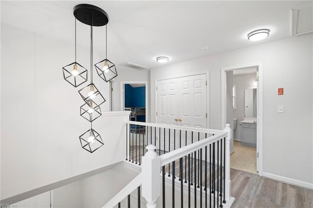 200 Burgundy Rd, Williamsburg, VA 23185 - hallway with an upstairs landing and light wood-type flooring