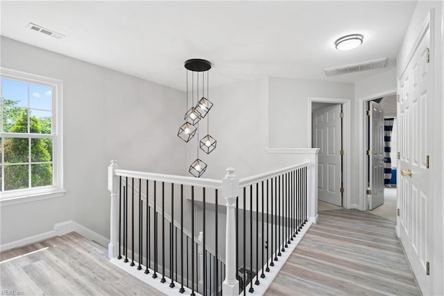 200 Burgundy Rd, Williamsburg, VA 23185 - hallway with an upstairs landing and light wood finished floors