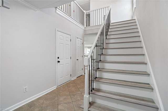 200 Burgundy Rd, Williamsburg, VA 23185 - staircase featuring tile patterned floors and a towering ceiling