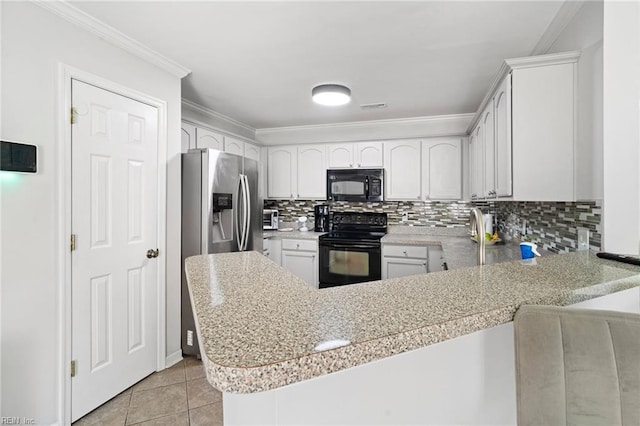 200 Burgundy Rd, Williamsburg, VA 23185 - kitchen featuring black appliances, a peninsula, backsplash, crown molding, and white cabinets