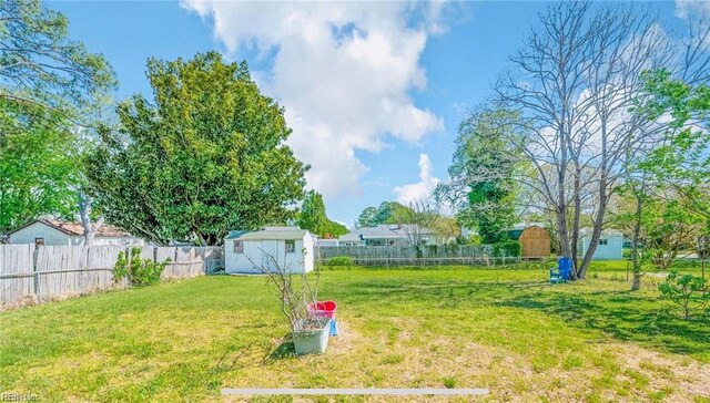 24 Saint Albans Dr, Hampton, VA 23669 - fenced backyard with a storage unit