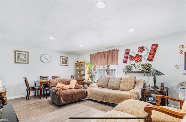 24 Saint Albans Dr, Hampton, VA 23669 - living area with light wood-type flooring, recessed lighting, and a textured ceiling