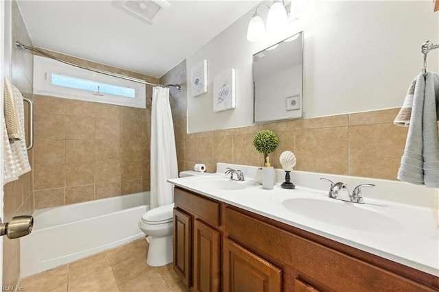 2007 Winfree Rd, Hampton, VA 23663 - bathroom featuring shower / bath combo with shower curtain, double vanity, tile patterned flooring, and tile walls