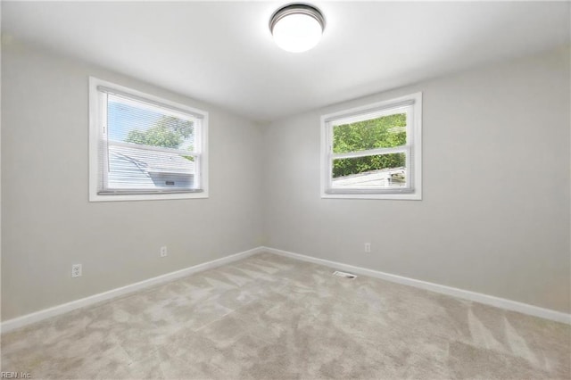 2007 Winfree Rd, Hampton, VA 23663 - empty room with healthy amount of natural light and light colored carpet