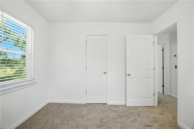 3559 Brest Ave, Norfolk, VA 23509 - unfurnished bedroom with multiple windows and carpet