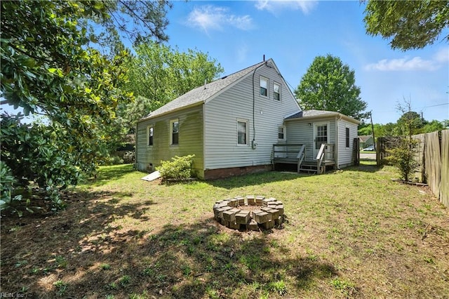 3559 Brest Ave, Norfolk, VA 23509 - rear view of house featuring a wooden deck, crawl space, and an outdoor fire pit