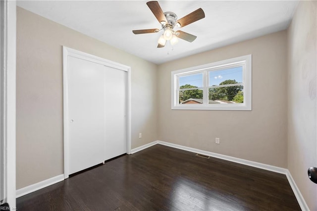 703 Terrace Dr, Newport News, VA 23601 - unfurnished bedroom with dark wood-type flooring, a closet, and ceiling fan
