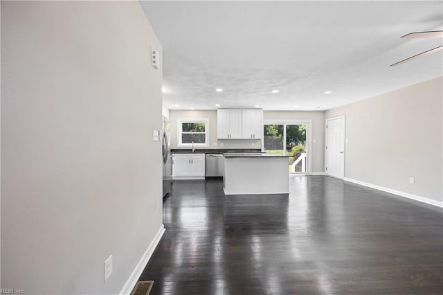 703 Terrace Dr, Newport News, VA 23601 - kitchen with appliances with stainless steel finishes, dark countertops, white cabinetry, dark wood finished floors, and recessed lighting