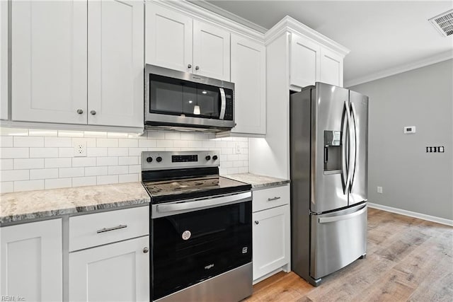 2152 Millville Rd, Chesapeake, VA 23323 - kitchen with appliances with stainless steel finishes, light wood-style floors, tasteful backsplash, ornamental molding, and white cabinets