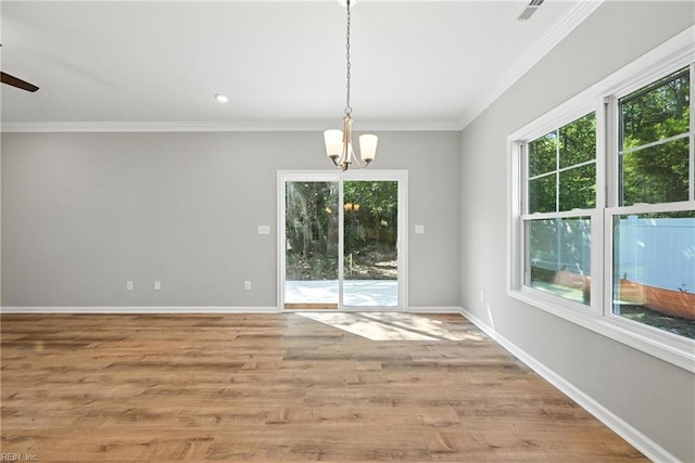 2152 Millville Rd, Chesapeake, VA 23323 - unfurnished dining area featuring a chandelier, crown molding, wood finished floors, and a ceiling fan