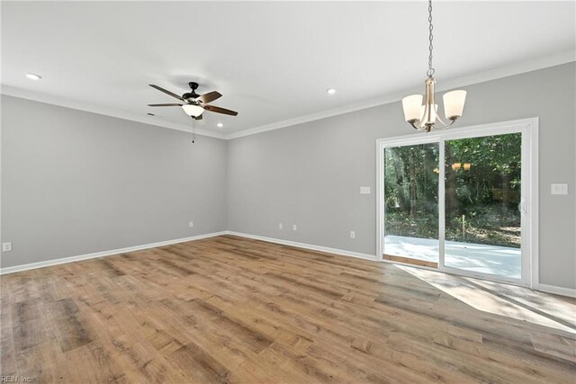 2152 Millville Rd, Chesapeake, VA 23323 - unfurnished room featuring a chandelier, ceiling fan, wood finished floors, recessed lighting, and crown molding