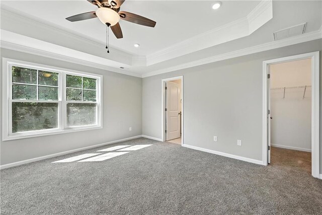 2152 Millville Rd, Chesapeake, VA 23323 - unfurnished bedroom with a tray ceiling, ornamental molding, carpet, a walk in closet, and recessed lighting
