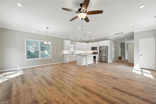 2152 Millville Rd, Chesapeake, VA 23323 - unfurnished living room with ornamental molding, ceiling fan, recessed lighting, light wood-style flooring, and a chandelier