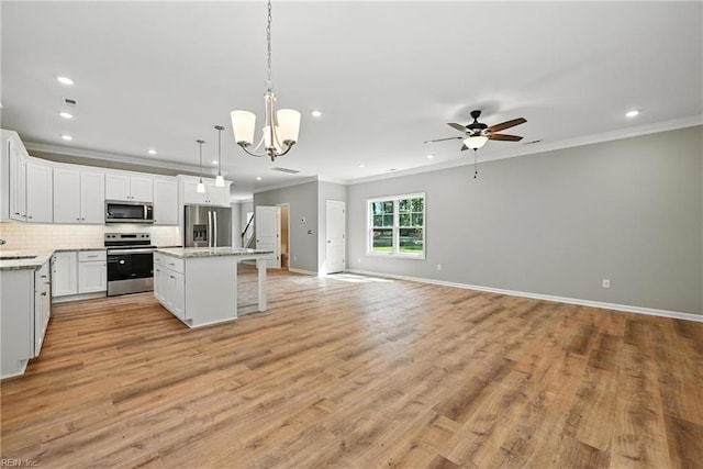 2152 Millville Rd, Chesapeake, VA 23323 - kitchen featuring appliances with stainless steel finishes, ornamental molding, open floor plan, recessed lighting, and ceiling fan