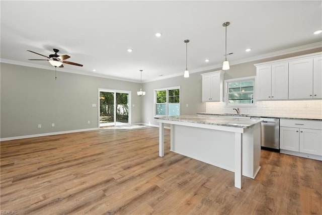 2152 Millville Rd, Chesapeake, VA 23323 - kitchen with stainless steel dishwasher, backsplash, white cabinetry, light wood-type flooring, and recessed lighting