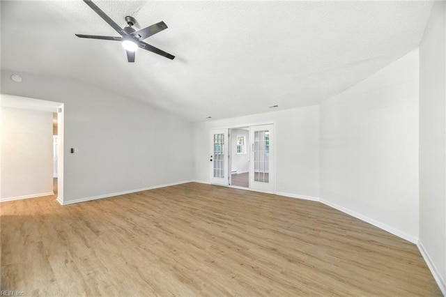 1409 Amberley Forest Rd, Virginia Beach, VA 23453 - empty room with light wood-style flooring, lofted ceiling, a ceiling fan, french doors, and a textured ceiling