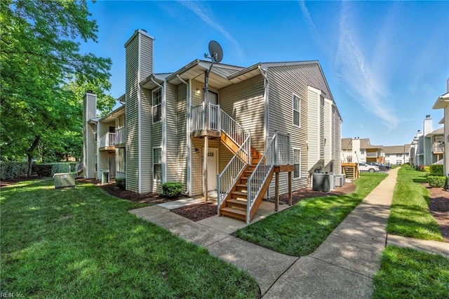 647 Crows Nest Ct, Virginia Beach, VA 23462 - rear view of property with a chimney, stairs, and a yard