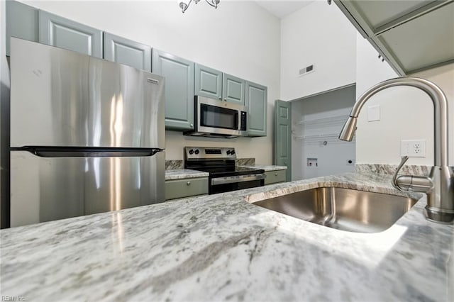 647 Crows Nest Ct, Virginia Beach, VA 23462 - kitchen with appliances with stainless steel finishes and light stone countertops