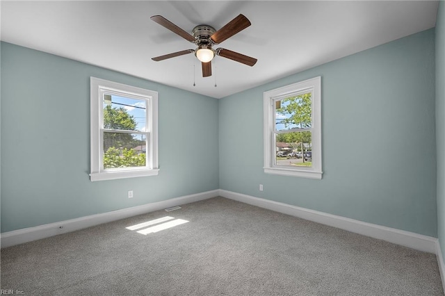 1003 Douglas Ave, Portsmouth, VA 23707 - unfurnished room featuring healthy amount of natural light, ceiling fan, and carpet flooring