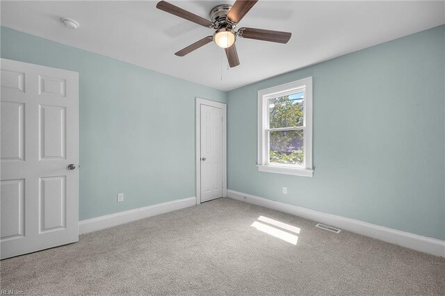1003 Douglas Ave, Portsmouth, VA 23707 - unfurnished bedroom with carpet flooring and a ceiling fan