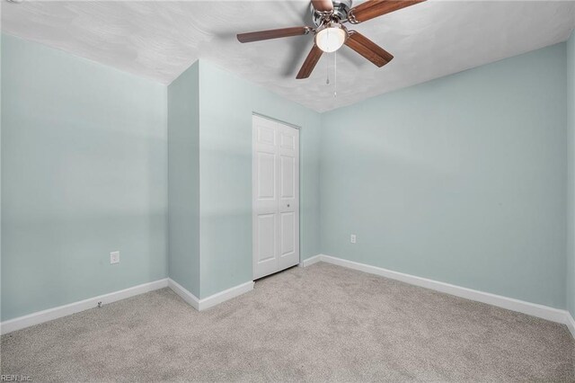 1003 Douglas Ave, Portsmouth, VA 23707 - unfurnished bedroom featuring carpet, a closet, and a ceiling fan