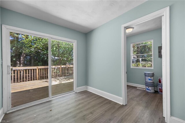 1003 Douglas Ave, Portsmouth, VA 23707 - empty room with baseboards and wood finished floors