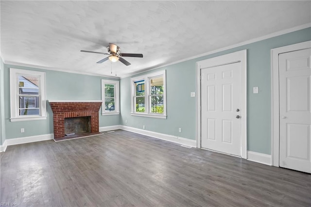 1003 Douglas Ave, Portsmouth, VA 23707 - unfurnished living room featuring ceiling fan, crown molding, wood finished floors, and a brick fireplace