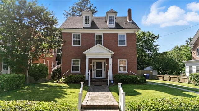 227 N Saratoga St, Suffolk, VA 23434 - view of front facade with a chimney and brick siding