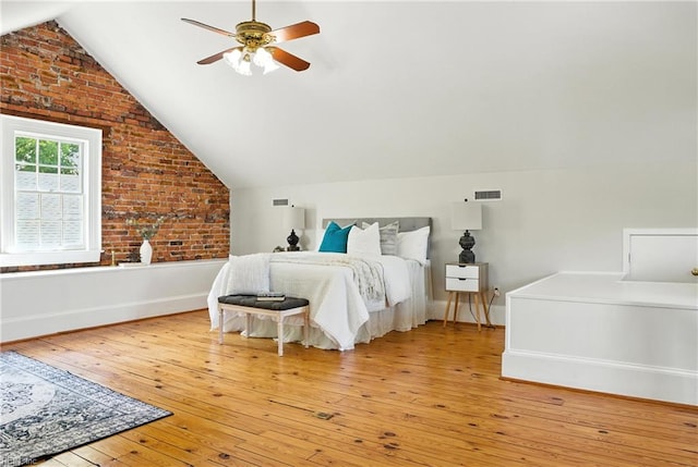 227 N Saratoga St, Suffolk, VA 23434 - bedroom featuring vaulted ceiling, hardwood / wood-style floors, brick wall, and ceiling fan