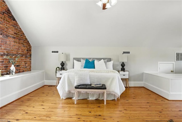 227 N Saratoga St, Suffolk, VA 23434 - bedroom with lofted ceiling and light wood-style floors