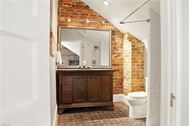 227 N Saratoga St, Suffolk, VA 23434 - full bath featuring vanity, brick wall, vaulted ceiling, and a shower