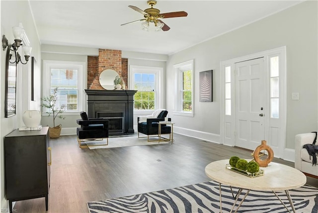 227 N Saratoga St, Suffolk, VA 23434 - foyer entrance featuring a fireplace, wood finished floors, and ceiling fan