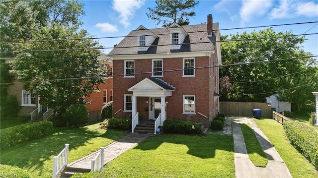 227 N Saratoga St, Suffolk, VA 23434 - view of front facade featuring a chimney and brick siding