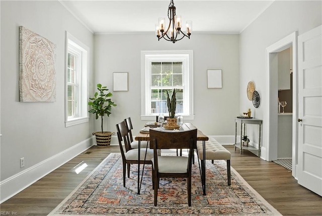 227 N Saratoga St, Suffolk, VA 23434 - dining room with a chandelier, ornamental molding, and dark wood-style floors