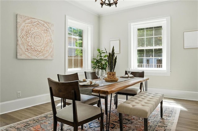 227 N Saratoga St, Suffolk, VA 23434 - dining space with wood finished floors, crown molding, and a chandelier