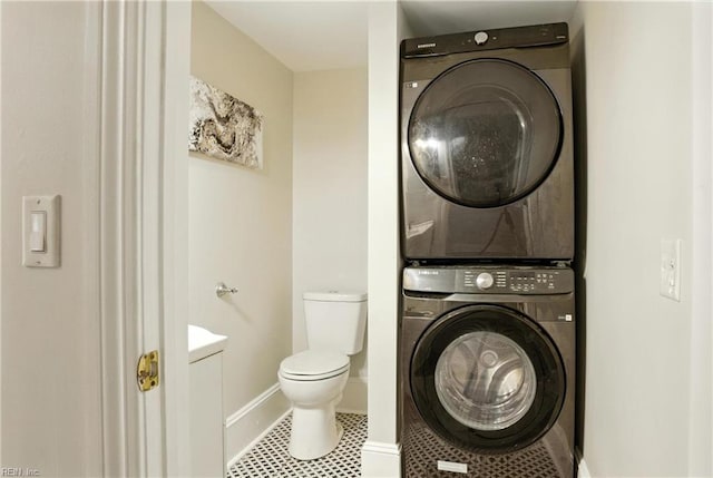 227 N Saratoga St, Suffolk, VA 23434 - washroom featuring stacked washer / drying machine and baseboards