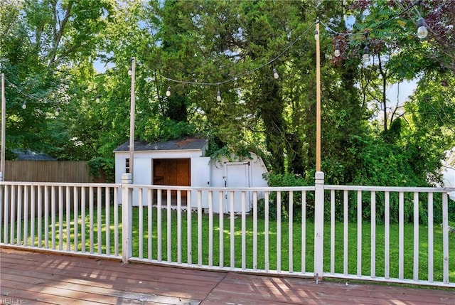 227 N Saratoga St, Suffolk, VA 23434 - wooden deck featuring a storage shed