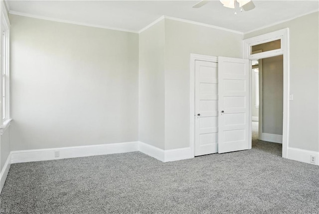 227 N Saratoga St, Suffolk, VA 23434 - unfurnished bedroom with carpet floors, crown molding, a ceiling fan, and a closet