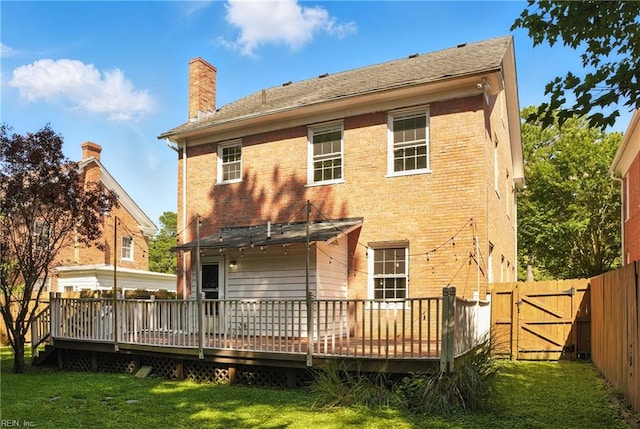227 N Saratoga St, Suffolk, VA 23434 - back of house with a fenced backyard, a chimney, a deck, and a gate