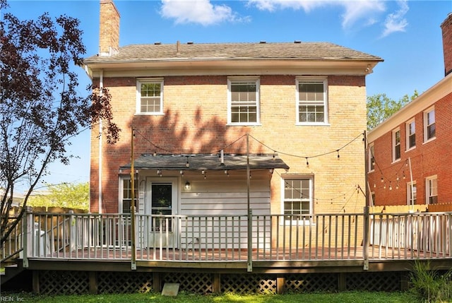 227 N Saratoga St, Suffolk, VA 23434 - back of property with brick siding, a chimney, and a wooden deck