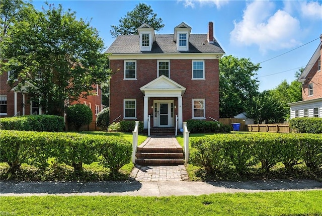 227 N Saratoga St, Suffolk, VA 23434 - view of front facade featuring a chimney and brick siding