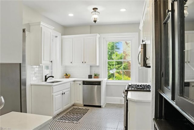 227 N Saratoga St, Suffolk, VA 23434 - kitchen with appliances with stainless steel finishes, light countertops, white cabinets, and recessed lighting
