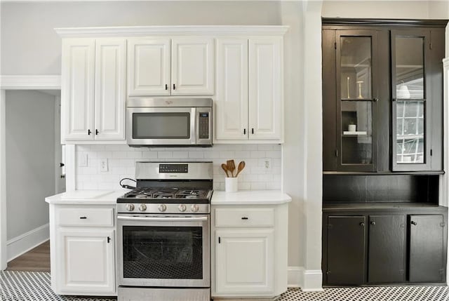 227 N Saratoga St, Suffolk, VA 23434 - kitchen featuring stainless steel appliances, white cabinets, and decorative backsplash