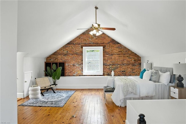 227 N Saratoga St, Suffolk, VA 23434 - bedroom featuring wood-type flooring, vaulted ceiling, ceiling fan, and brick wall