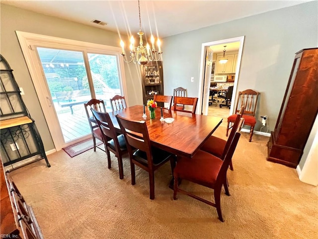 600 Cambria Ct, Virginia Beach, VA 23455 - dining room with light carpet and a chandelier