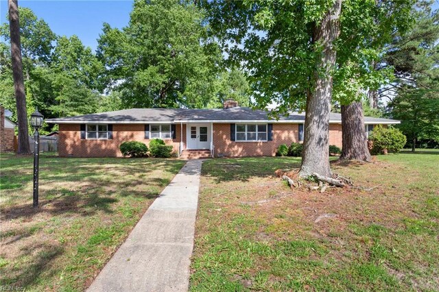 416 N Broad St, Suffolk, VA 23434 - single story home with a front yard, brick siding, and a chimney