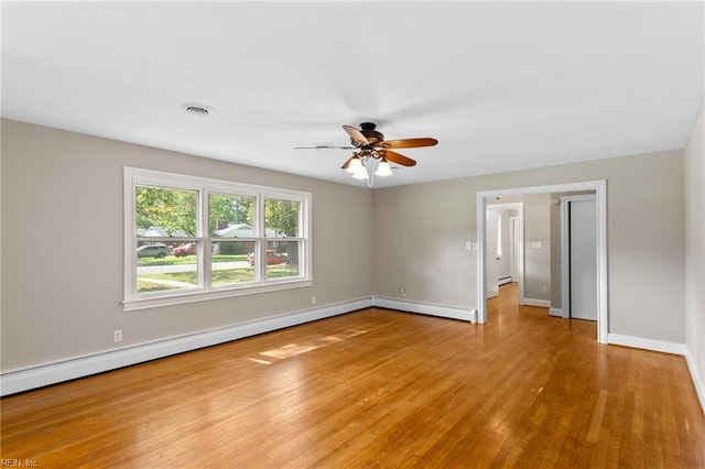 416 N Broad St, Suffolk, VA 23434 - unfurnished room with wood finished floors, ceiling fan, and baseboard heating