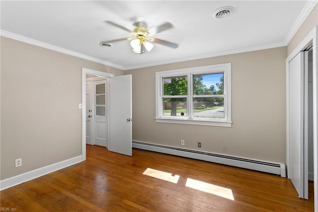 416 N Broad St, Suffolk, VA 23434 - unfurnished bedroom with a baseboard heating unit, wood finished floors, ornamental molding, and ceiling fan